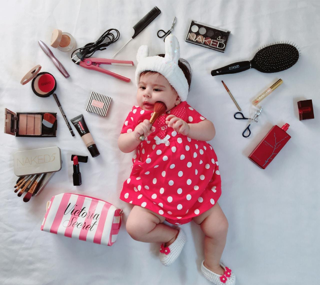 adorable-baby-surrounded-by-makeup-and-cosmetics-35355923